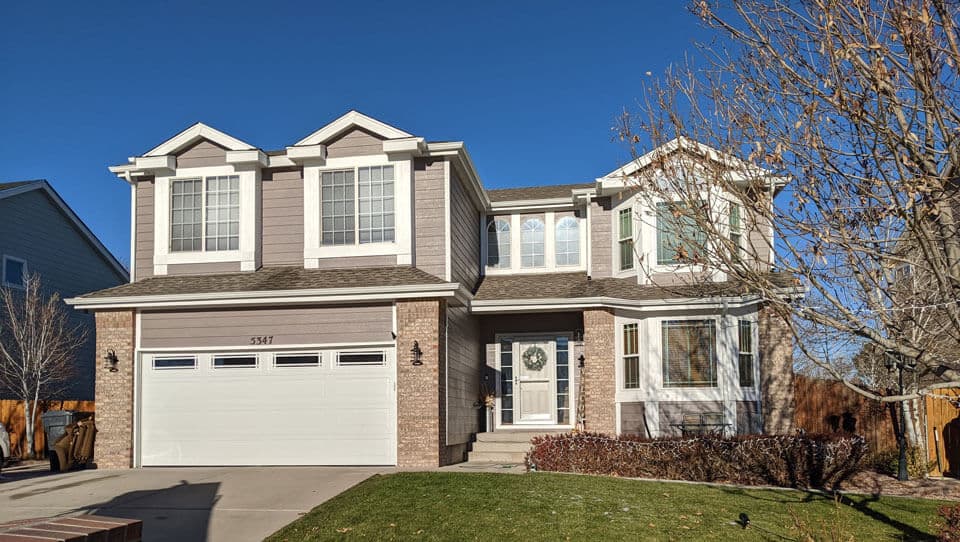 Regency Series steel garage door with decorative windows in Pueblo, Colorado